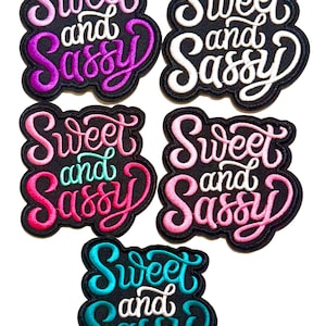 May include: A set of three ceramic mugs with a speckled, matte finish. Each mug features a different color: light blue, cream, and gray. The mugs have a simple, modern design with a rounded shape and a comfortable handle.