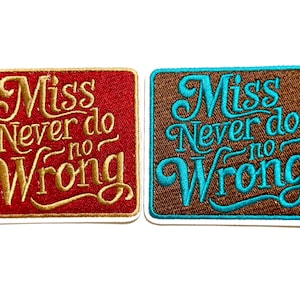 May include: Two embroidered patches with the text "Miss Never do no Wrong". One patch is red with gold lettering, the other is brown with teal lettering. Both have a white border.