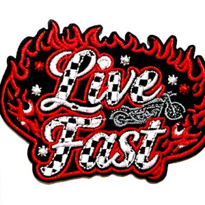 May include: Embroidered patch with the words "Live Fast" in white, checkered letters, and a motorcycle graphic. The patch is outlined in red flames on a black background. The patch measures approximately 3 inches in height.
