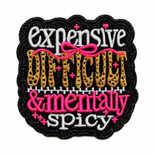 May include: A black embroidered patch with a scalloped edge featuring the white text expensive, gold leopard-print text difficult, and pink text & mentally spicy. A pink bow sits above the gold text, and small pink star accents are scattered.