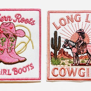 May include: Two embroidered patches with a Western theme. One features a pink cowboy boot and hat with the text "Southern Roots Cowgirl Boots." The other shows a cowgirl on a horse with the text "Long Live Cowgirls."