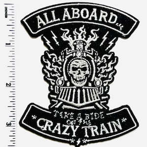 May include: Black and white embroidered patch with the text "ALL ABOARD" at the top. The patch features a train with a skull face, lightning bolts, and the text "TAKE A RIDE ON THE CRAZY TRAIN". The patch measures approximately 3 inches in height.