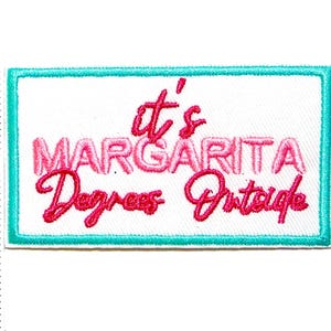 May include: Embroidered patch with the phrase "It's Margarita Degrees Outside" in pink script on a white background, framed by a teal border. The patch measures approximately 2 inches in height.