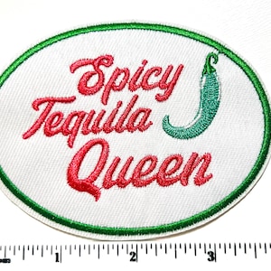 May include: Embroidered patch with the words "Spicy Tequila Queen" in red script, a green chili pepper, and a green border. The patch is oval-shaped and set against a white background.