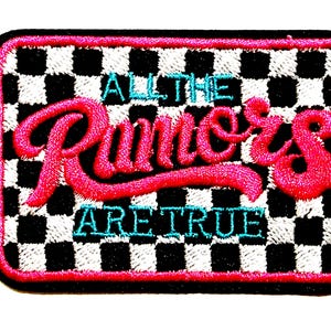 May include: Embroidered patch with a black border and a checkered black and white background. The patch features the text "ALL THE Runners ARE TRUE" in pink and teal thread. The patch measures approximately 2 inches by 3 inches.