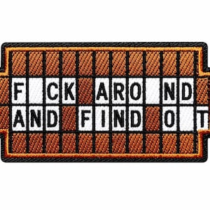 May include: A rectangular embroidered patch with a black border, featuring a grid of brown and white squares. The white squares contain the black text FUCK AROUND AND FIND OUT, arranged in a crossword-style layout against the brown background.