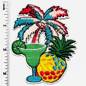 May include: Embroidered patch featuring a tropical theme. The design includes a palm tree with red, blue, and white fronds, a green margarita, and a yellow pineapple with red and blue accents. The patch measures approximately 3 inches in height.