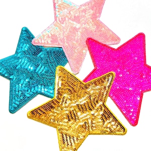 May include: Five sequined star patches in vibrant colors: turquoise, pink, fuchsia, gold, and light pink. Each star has a different color and is made of shiny sequins. These patches are perfect for adding a touch of sparkle to clothing or accessories.