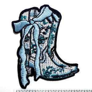 May include: A set of three ceramic mugs with a speckled, matte finish. The mugs are in shades of cream, light gray, and dark gray. Each mug has a simple, minimalist design, perfect for coffee or tea.