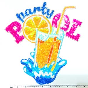 May include: A sequined patch with the words "party pool" in blue and pink. The design features a glass of orange juice with a straw, a lemon slice, and blue water splashes. The patch is ideal for decorating clothing or accessories.
