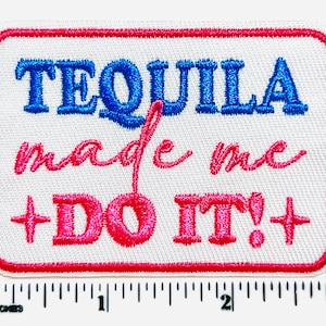 May include: White rectangular patch with a red border. The text "TEQUILA made me + DO IT!+" is embroidered in blue and pink. The patch measures approximately 3 inches wide.