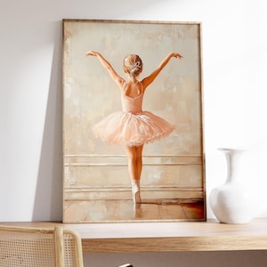 May include: A painting of a young ballerina wearing a pink tutu and white pointe shoes. The ballerina is standing on one leg with her arms outstretched. The background is a light beige colour.