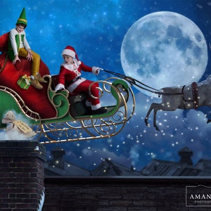 May include: A red and green sleigh with a Santa Claus and an elf riding in it. The sleigh is being pulled by a reindeer flying through the air with a full moon in the background.
