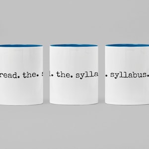 May include: Three white coffee mugs with a blue rim and handle. The mugs have the text "read. the. syllabus." printed on them.