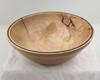 Hard maple bowl with knot and crack feature