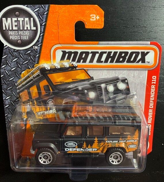 Land Rover Defender 110X ミニカー Matchbox Land Rover Defender 110-matte Black With Orange Windows
