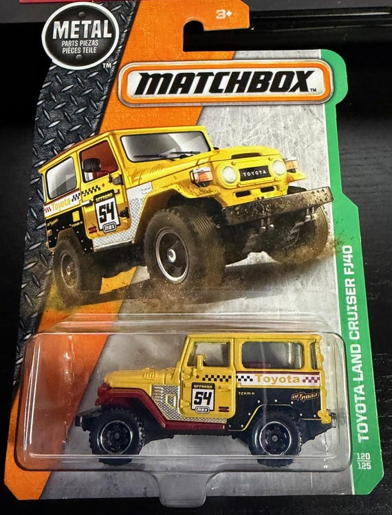 Matchbox 1968 Toyota Land Cruiser FJ40- Yellow With Brown Roof