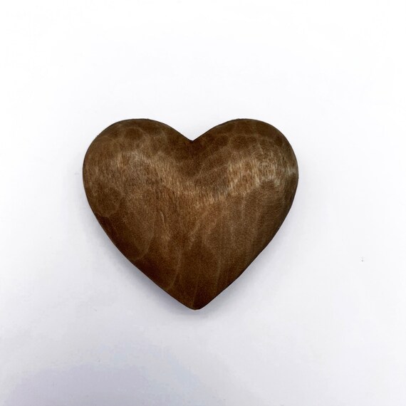 Carved small wooden hearts on table Stock Photo by ©stahov 144045503