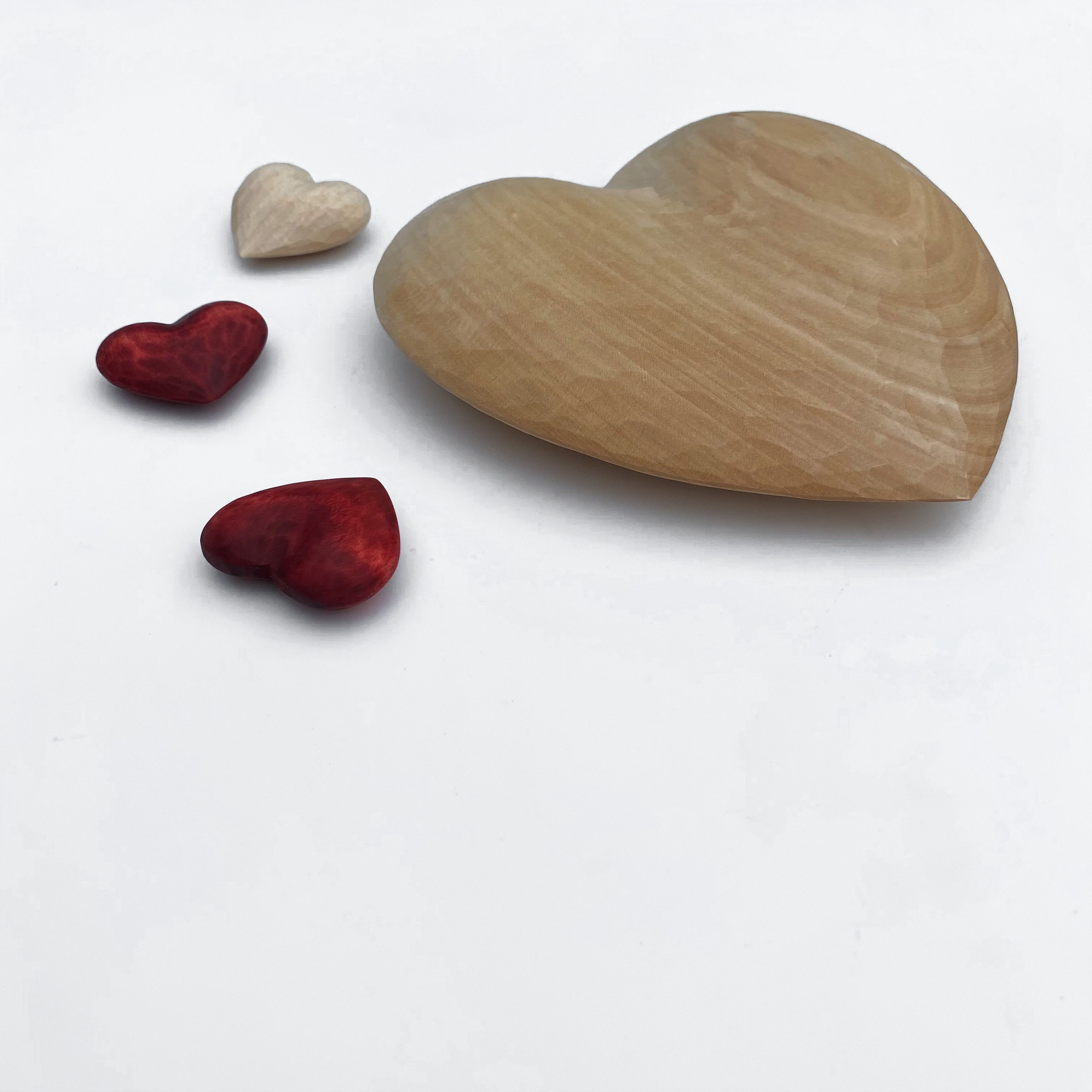 Carved small wooden hearts on table Stock Photo by ©stahov 144045503