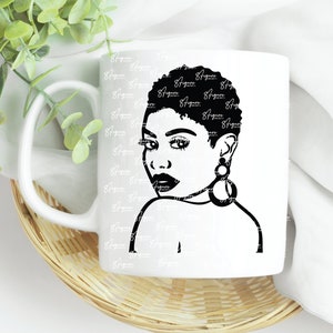 May include: White ceramic mug with a black and white illustration of a woman with short hair and large hoop earrings. The woman is looking over her shoulder.