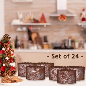 Può includere: Set di 24 pirottini per cupcake in carta marrone e argento. I pirottini hanno un bordo ondulato e un design decorativo.