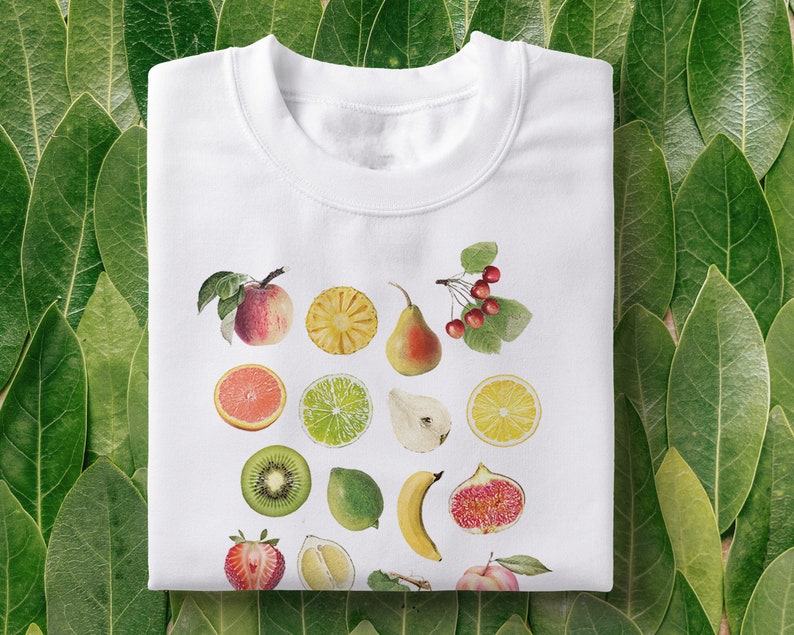 100% Cotton Unisex T-shirt in White, with print of mixed fruit: apple, orange, pear, cherries, pineapple, figs, citrus, kiwi, strawberry, pomegranate, lemon, lime, dragonfruit, grapes, peach, banana