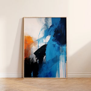 May include: Abstract painting with bold strokes of blue, orange, and black paint. The painting is framed in a light wood frame.