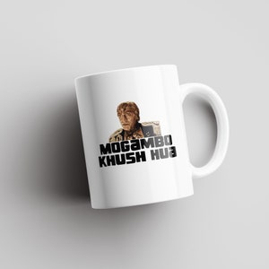 May include: White ceramic mug with a black and white image of a man with the text "Mogambo Khush Hua" printed on it.