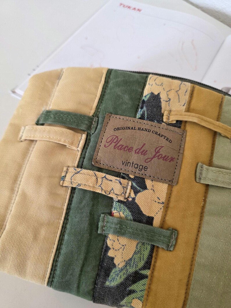 Repurposed denim makeup bag styled beside books, journal or planner. Works as pencil case, accessory holder or everyday bag organiser for mindful creative routines.