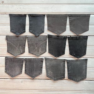 These unique grey denim pockets are reclaimed from pre-loved jeans, perfect for sustainable crafting projects.