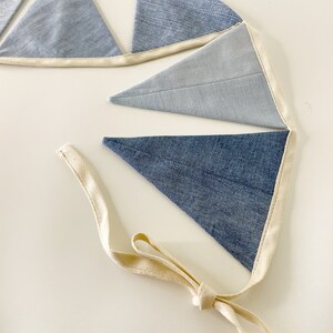 The fabric flags are sewn to a sturdy natural cotton cord with an extra 50 cm (~20 in) on each side for hanging.