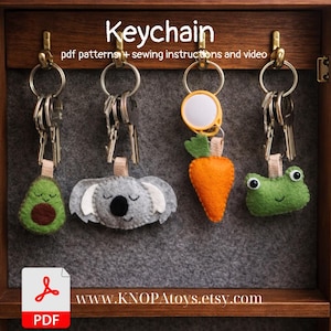May include: A collection of handmade felt keychains, including an avocado, koala, carrot, and frog. Each keychain is attached to a metal keyring. The word "Keychain" is displayed at the top of the image, along with the text "pdf patterns + sewing instructions and video".