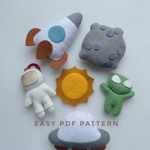 May include: Felt craft patterns for making a rocket, astronaut, alien, sun, and UFO. The patterns are easy to follow and perfect for beginners.  EASY PDF PATTERN is written on the white background.