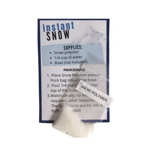 May include: A white plastic bag containing white powder, labelled "Snow Polymer". The bag is on a white card with instructions for making instant snow. The card reads "instant SNOW" and includes a list of supplies and a procedure.