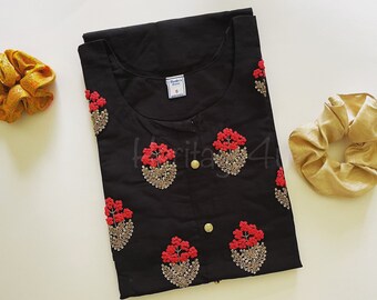 May include: Black cotton tunic top with red and gold floral embroidery. The top has a round neckline and a button closure. The size tag says "S".