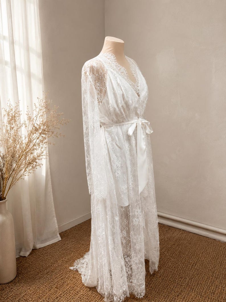 White lace robe for bride with romantic train detail