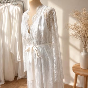 Bridal getting ready robe with lace sleeves and train