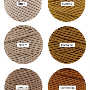 May include: Six spools of cotton cord in different colours: linen, sunrise, cream, turmeric, mocha, and terracotta.
