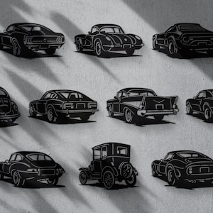 May include: Black silhouette cutouts of classic cars, including a vintage Volkswagen Beetle, a Ford Mustang, and a classic convertible. The collection features various car models, showcasing a range of automotive designs.
