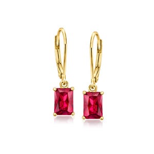 May include: A pair of gold-colored leverback earrings, each featuring a rectangular, vibrant red gemstone. The earrings are displayed against a white background, highlighting the jewelry's design and color.