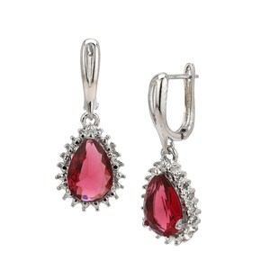 May include: A pair of silver drop earrings. Each earring has a teardrop-shaped, ruby-red gemstone, encircled by small, clear crystals. The earrings have a lever-back closure. The gemstones are approximately 1.5 cm in length.