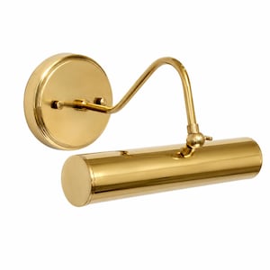 May include: A polished brass picture light featuring a circular wall-mounting plate and a slender, cylindrical lamp head. The fixture includes an adjustable arm with a swivel joint, allowing for precise positioning of the light source.