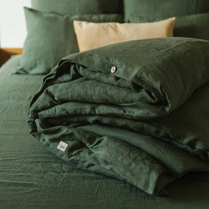 Forest green linen duvet cover on bed