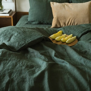 Forest green linen duvet cover on bed