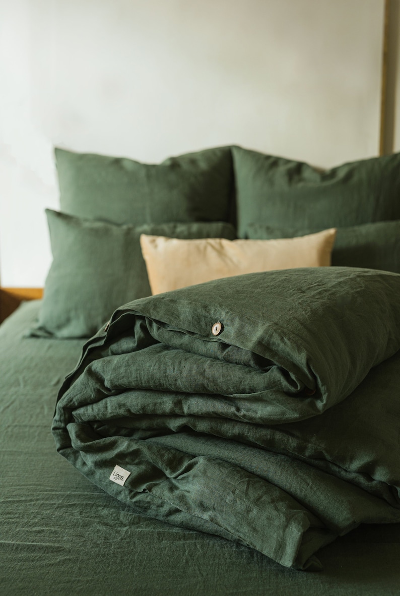 Forest green linen duvet cover on bed