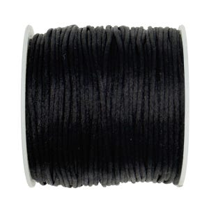 May include: A spool of black cord wrapped tightly around a white cylindrical core. The cord features a smooth, matte texture and is wound in multiple parallel rows, creating a uniform appearance across the entire surface of the spool.