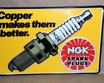 Vintage NGK Spark Plugs Embossed Tin Sign: "Copper Makes Them Better"