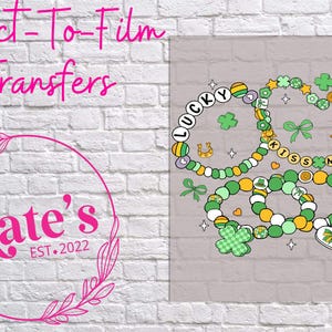 May include: A sheet of clear transfer film with four colorful bracelets. The bracelets are decorated with shamrocks, hearts, and the words "Lucky" and "Kiss Me".