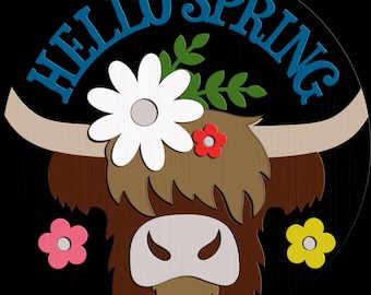 May include: A wooden sign with a black background features a Highland cow design. The cow is brown with a white face and is adorned with flowers. The words "HELLO SPRING" are in blue above the cow's head. Additional flowers in pink and yellow are also present.