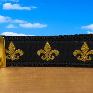 Fleur De Lis-sleutelhanger met messing vergulde hardware